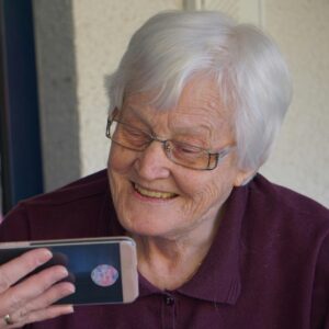 woman looking at mobile phone